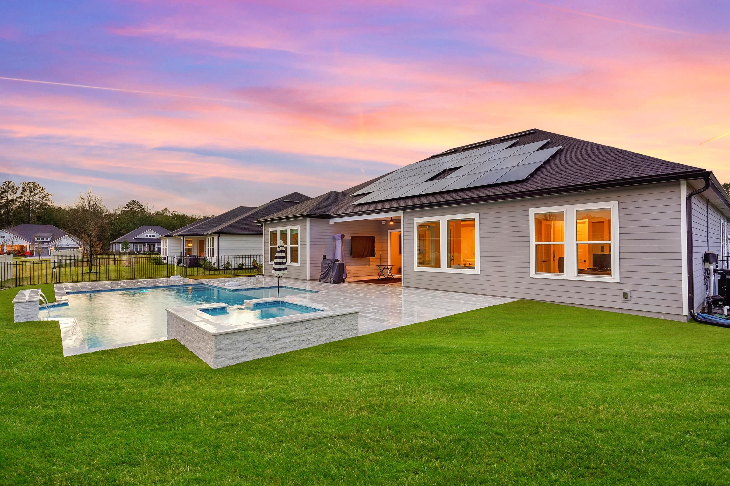 64 Oak Cluster Lane St. Augustine, FL 32092 - Photo 41 of 59 a front view of a house with a garden