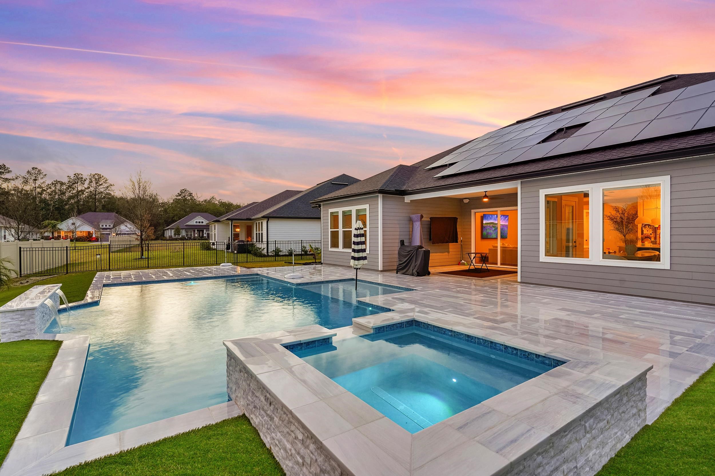 64 Oak Cluster Lane St. Augustine, FL 32092 - Photo 44 of 59 a view of a house with pool and chairs