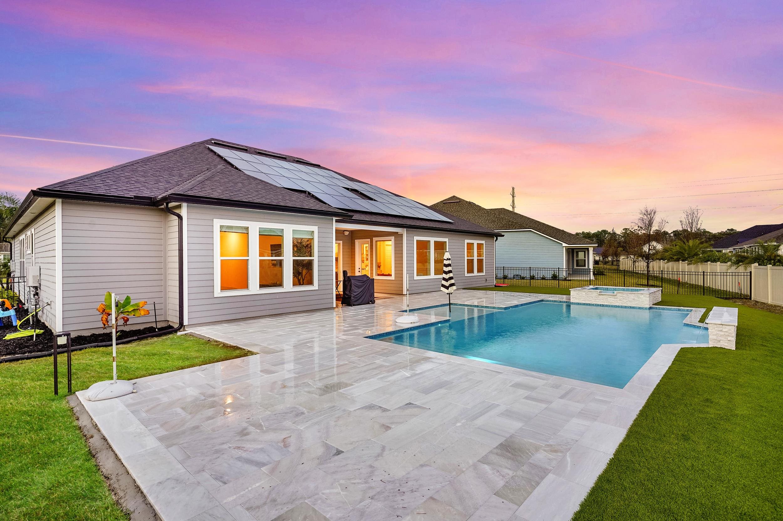 64 Oak Cluster Lane St. Augustine, FL 32092 - Photo 45 of 59 a view of a house with swimming pool and a yard