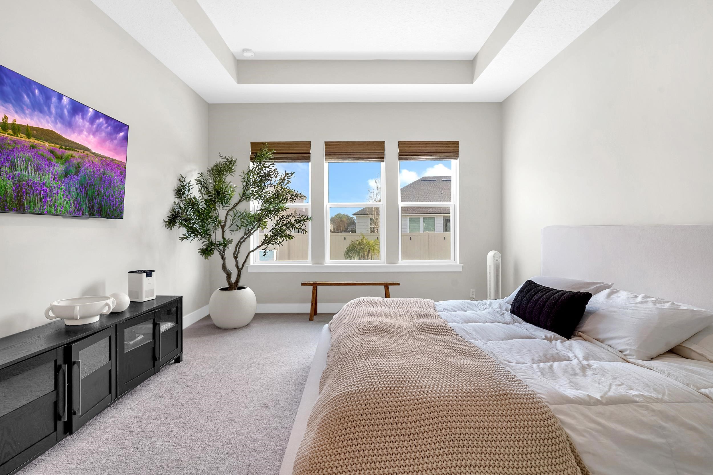 64 Oak Cluster Lane St. Augustine, FL 32092 - Photo 4 of 59 a bedroom with a bed and a window