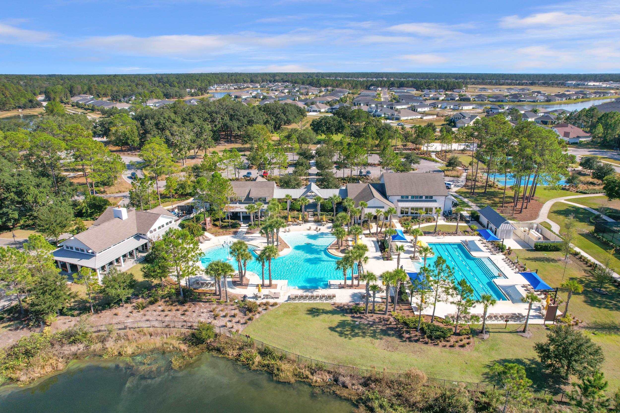 64 Oak Cluster Lane St. Augustine, FL 32092 - Photo 56 of 59 a view of a city with lots of residential buildings ocean and mountain view in back