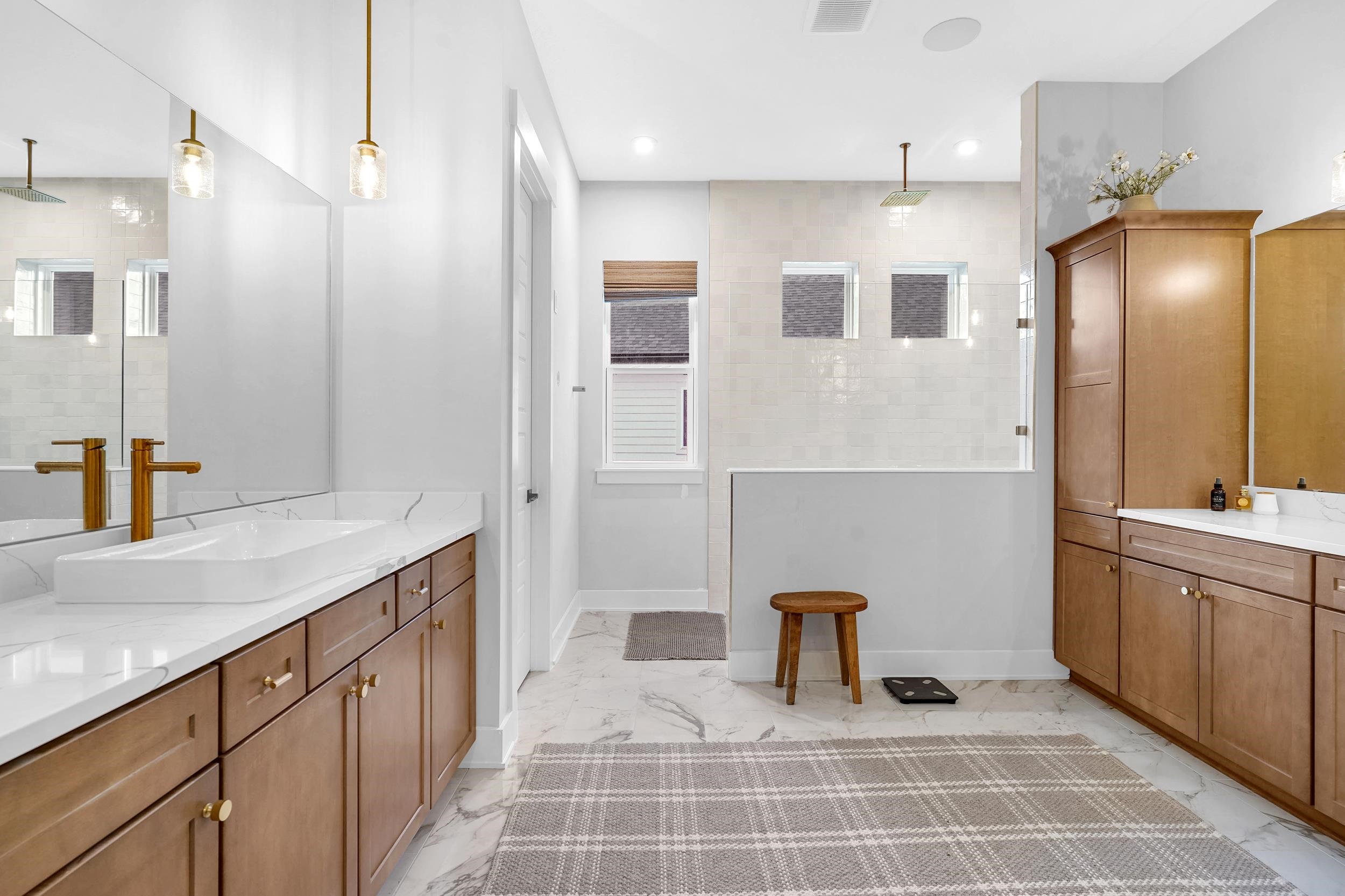 64 Oak Cluster Lane St. Augustine, FL 32092 - Photo 5 of 59 Bathroom featuring vanity, light marble finish floors, a walk in shower, and recessed lighting
