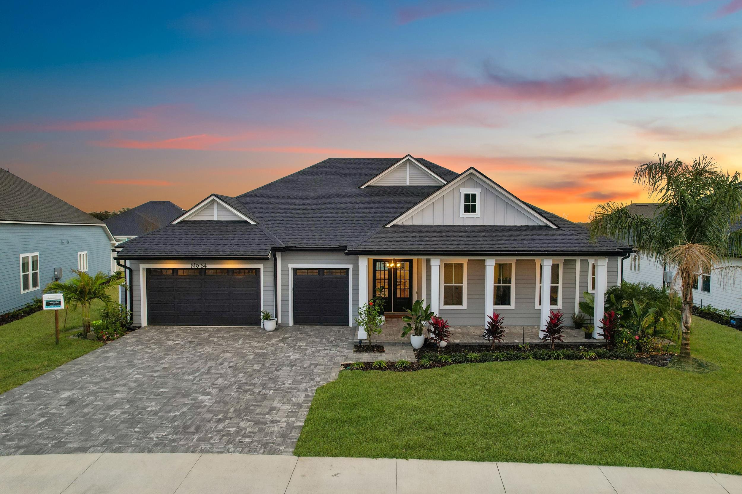 64 Oak Cluster Lane St. Augustine, FL 32092 - Photo 7 of 59 a front view of a house with garden