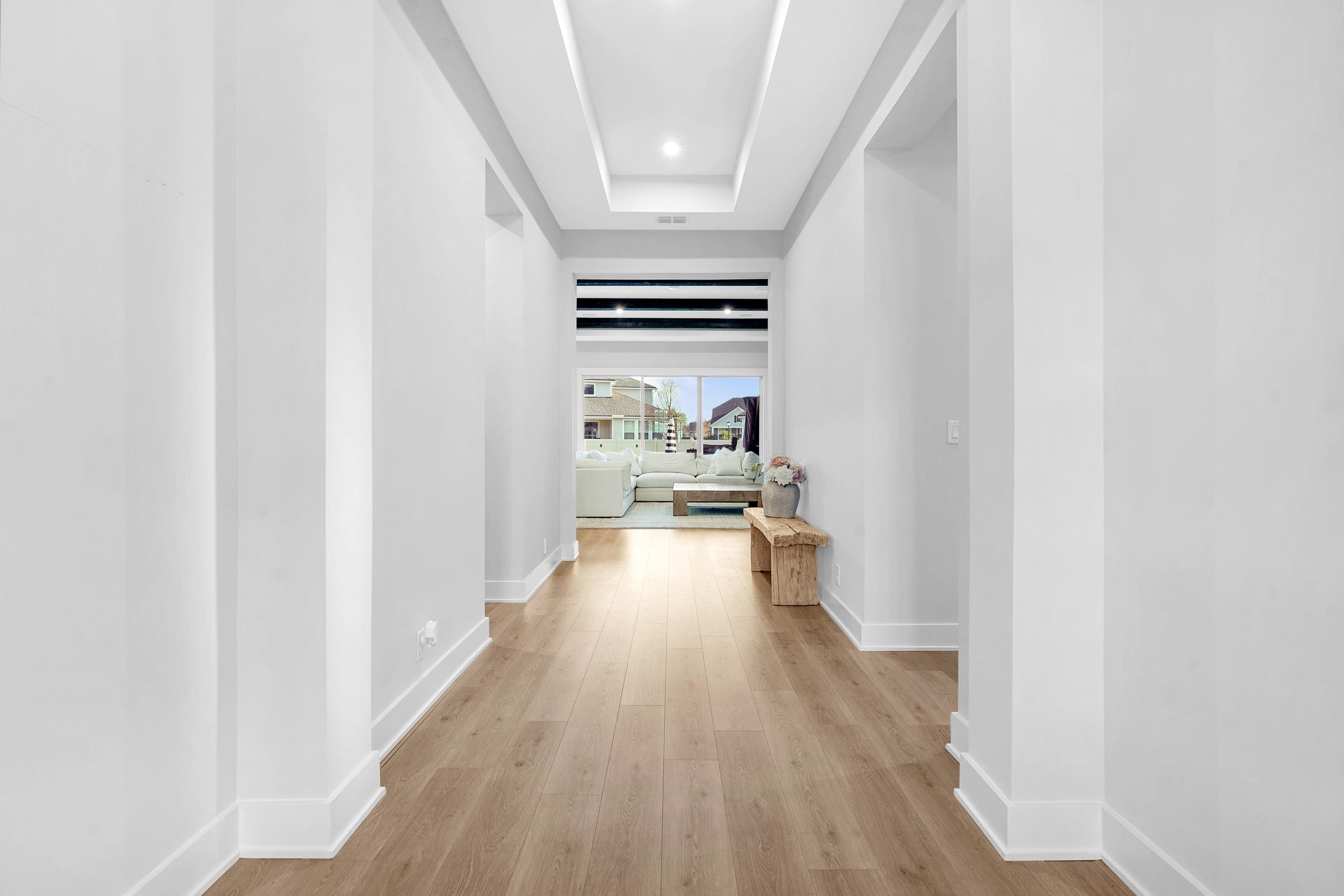 64 Oak Cluster Lane St. Augustine, FL 32092 - Photo 9 of 59 a view of a hallway with wooden floor and furniture