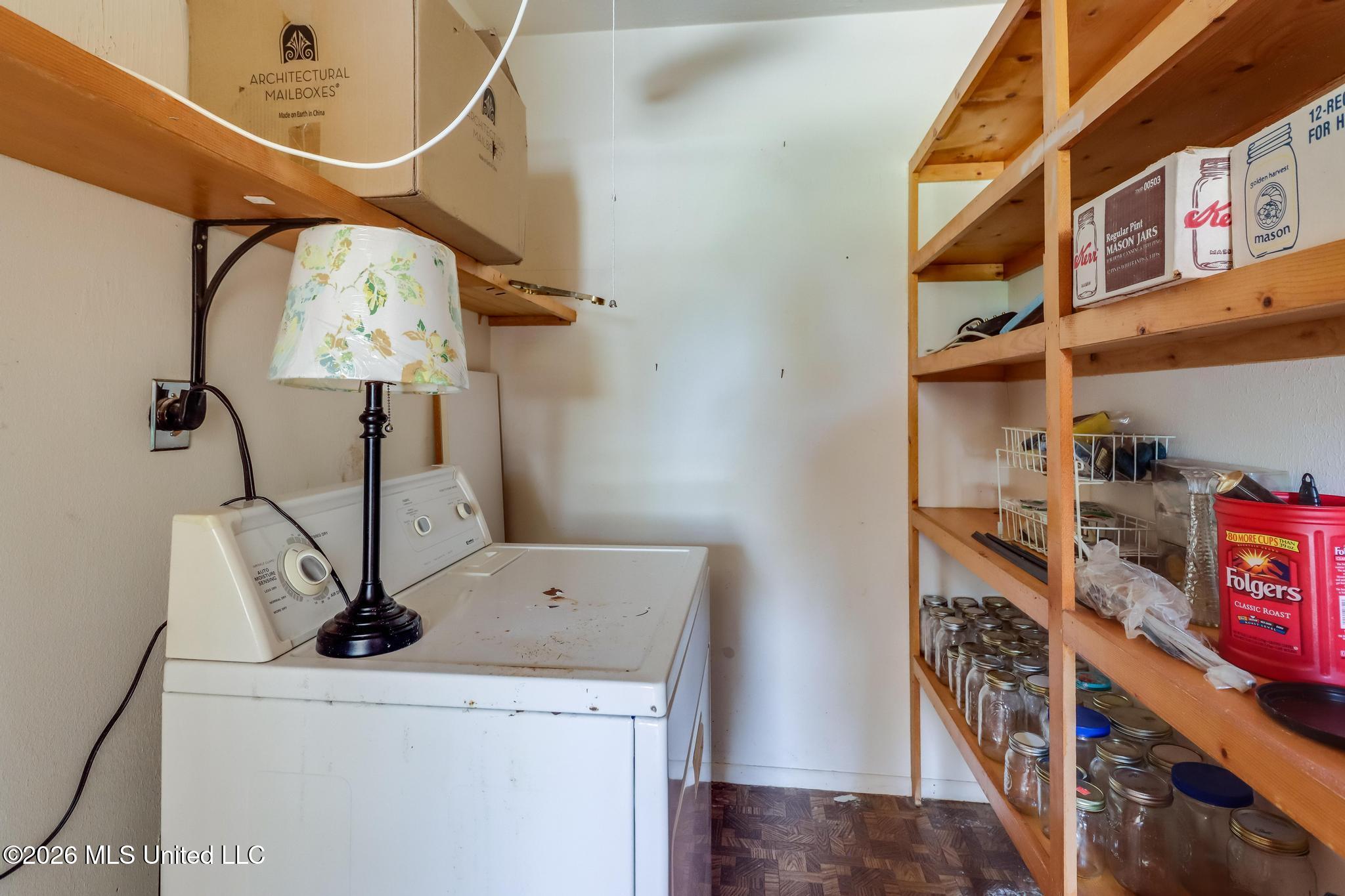 416 Howard Street Wiggins, MS 39577 - Photo 25 of 31 Laundry with storage