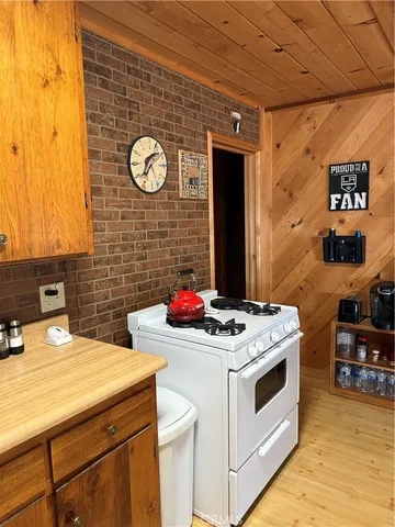 a kitchen with a stove and cabinets