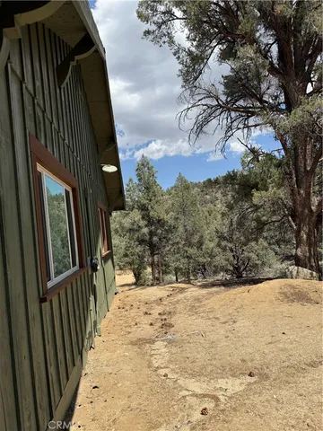 a view of a yard covered in snow