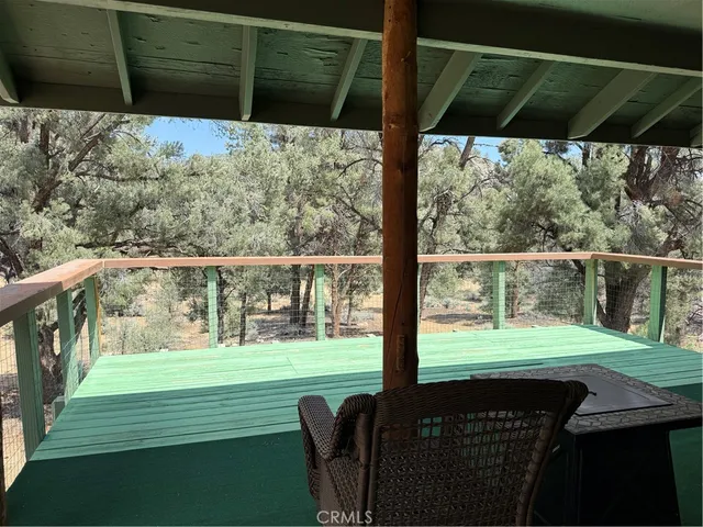 a view of a deck with a yard