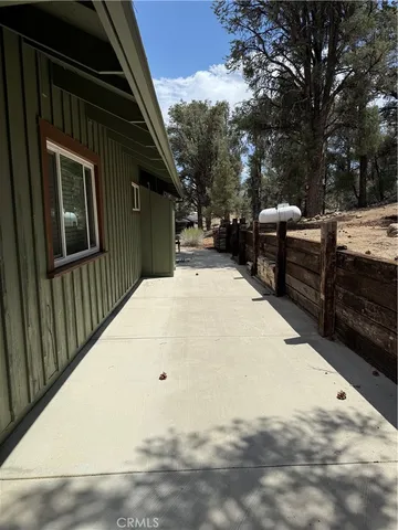 a view of backyard with sitting area
