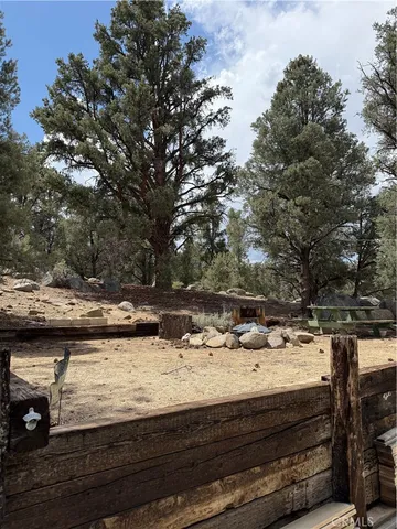 a view of a house with wooden floor and fence