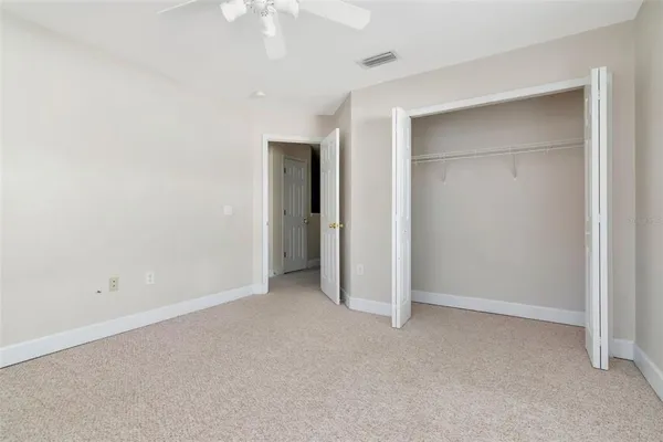 an empty room with closet area