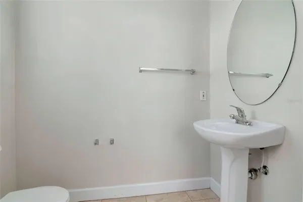 a bathroom with a sink and mirror