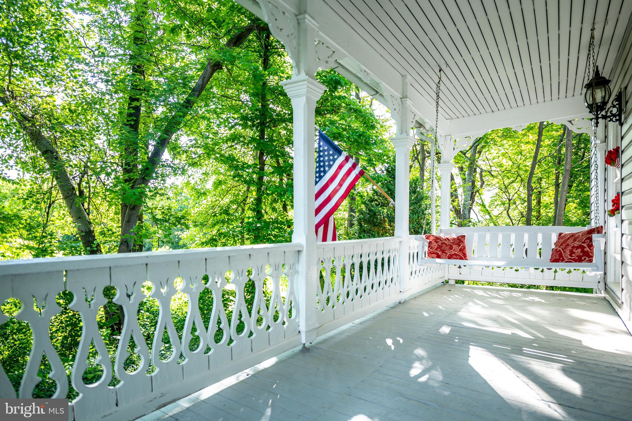 142 White Hall Road Winchester, VA 22603 - Photo 5 of 53 Morning sun beaming thru the trees onto the porch