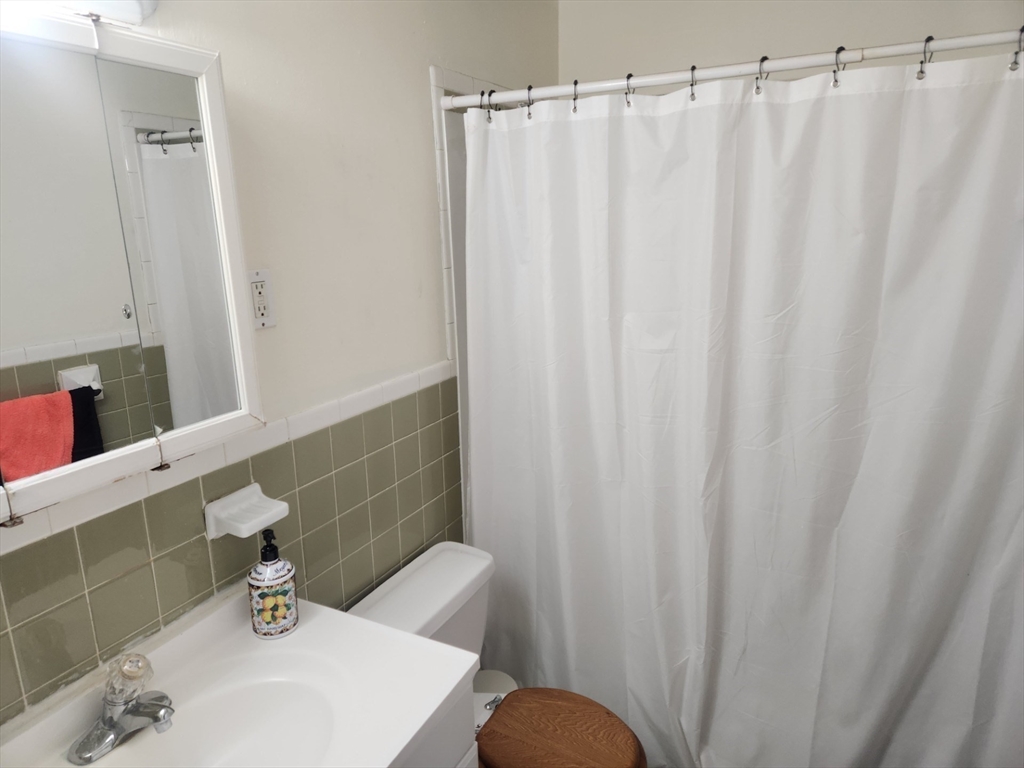 176 Maple Avenue, Unit 22 Rutland, MA 01543 - Photo 7 of 9 a bathroom with a sink and a mirror