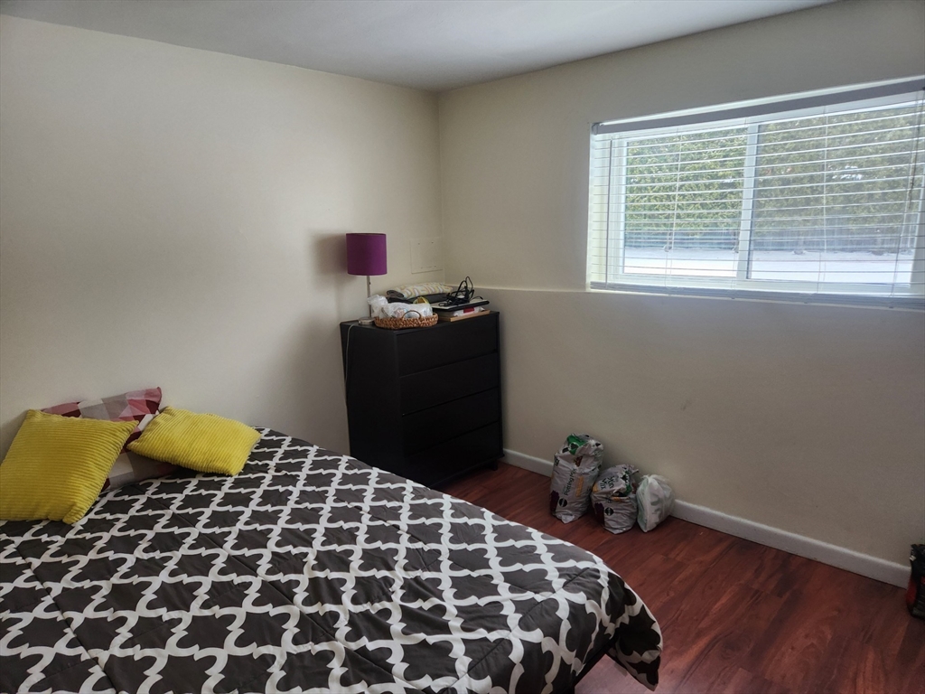 176 Maple Avenue, Unit 22 Rutland, MA 01543 - Photo 8 of 9 a bedroom with a bed and a window