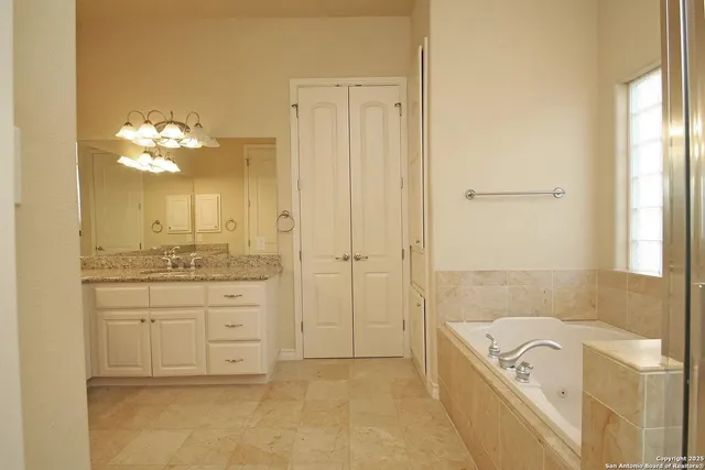 a bathroom with a tub and shower