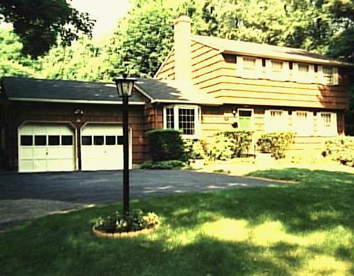 117 Walnut Grove Road Ridgefield, CT 06877 - Photo 1 of 1 a front view of a house with garden