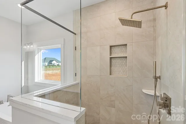 a bathroom with a tub and shower