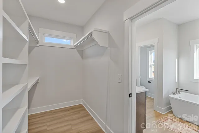 a bathroom with a bathtub and shower