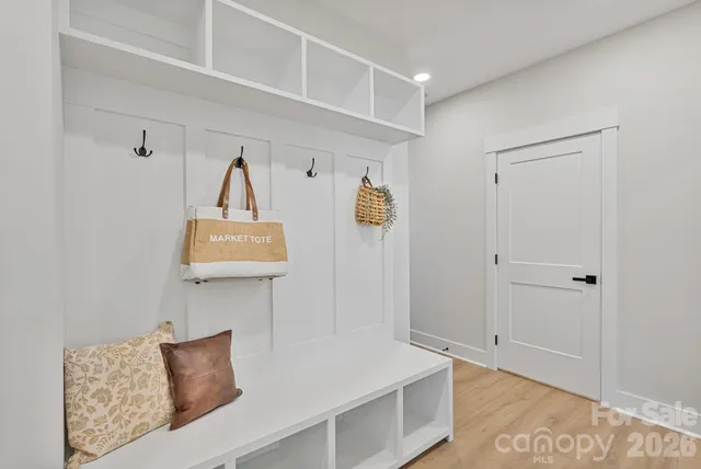 a view of room with furniture and wooden floor