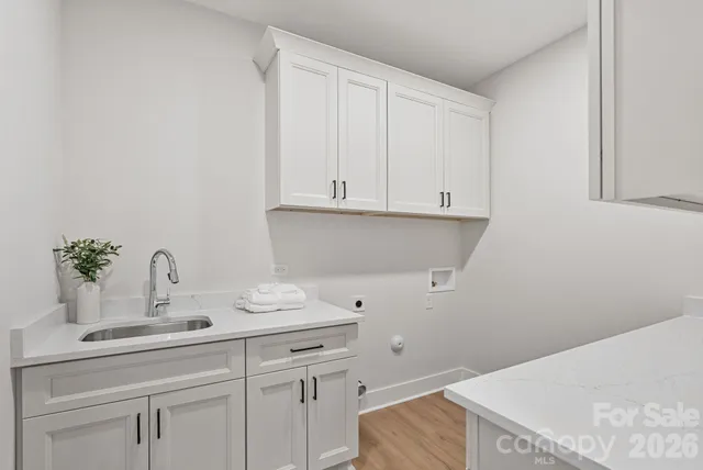 a kitchen with a sink and cabinets