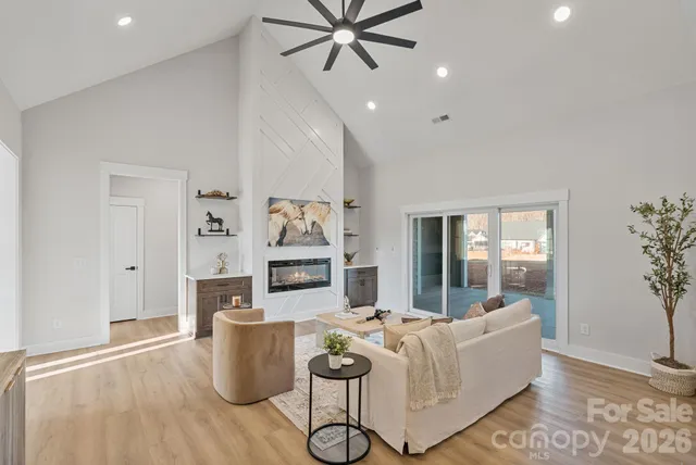 a living room with furniture and a large window