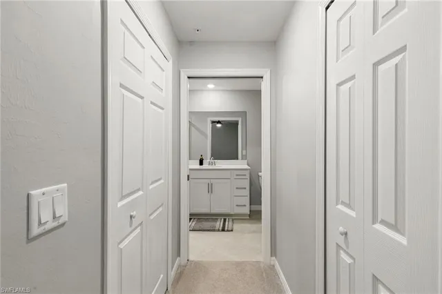 a bathroom with a sink and mirror