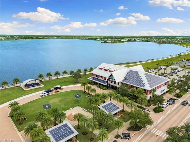 an aerial view of a house with a lake view