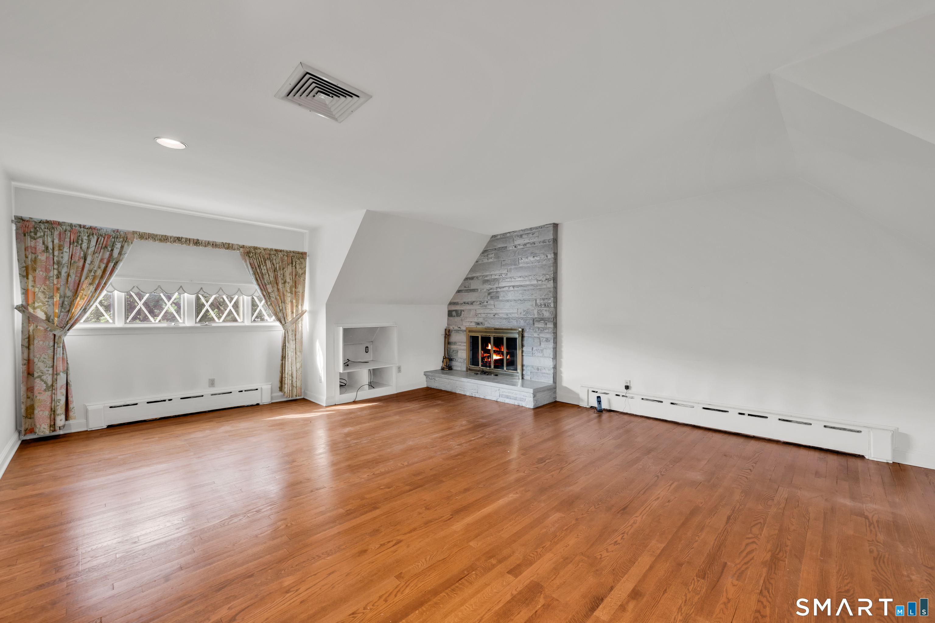 232 Maybrook Road Waterbury, CT 06708 - Photo 21 of 38 a view of an empty room with wooden floor and a window