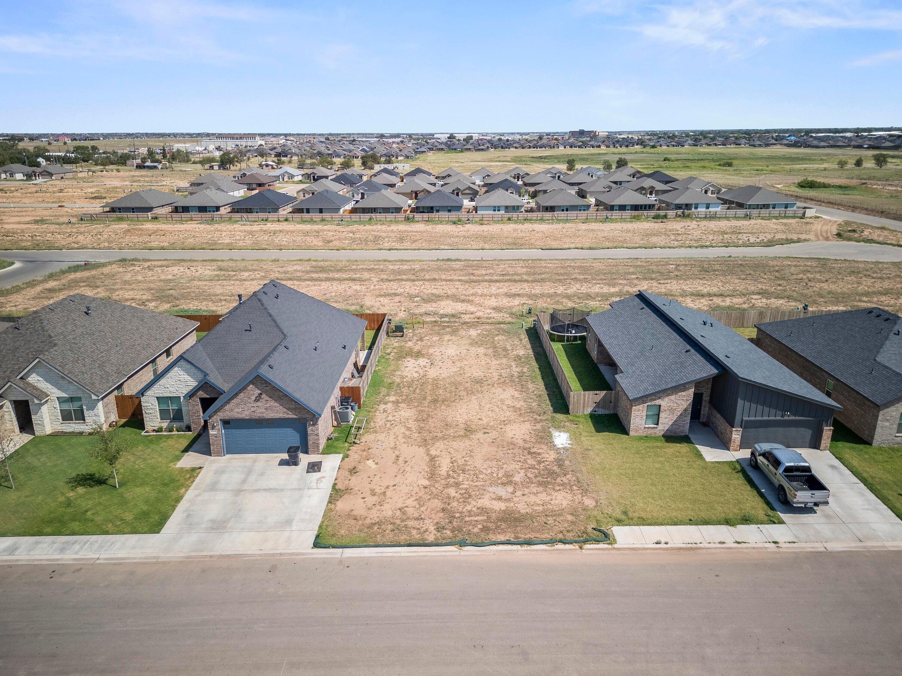 7815 95th Street Lubbock, TX 79424 - Photo 11 of 11 an aerial view of residential houses with outdoor space