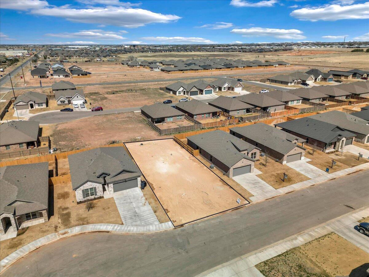 7815 95th Street Lubbock, TX 79424 - Photo 6 of 11 an aerial view of residential building with outdoor space