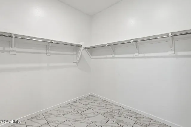 a view of an empty walk in closet