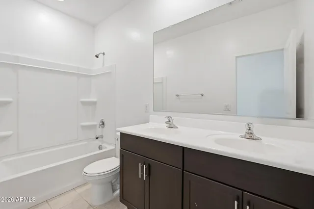 a bathroom with a sink toilet a vanity and bathtub