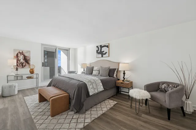 a spacious bedroom with a bed and a couch