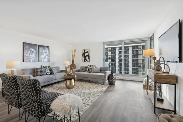 a living room with furniture and a large window