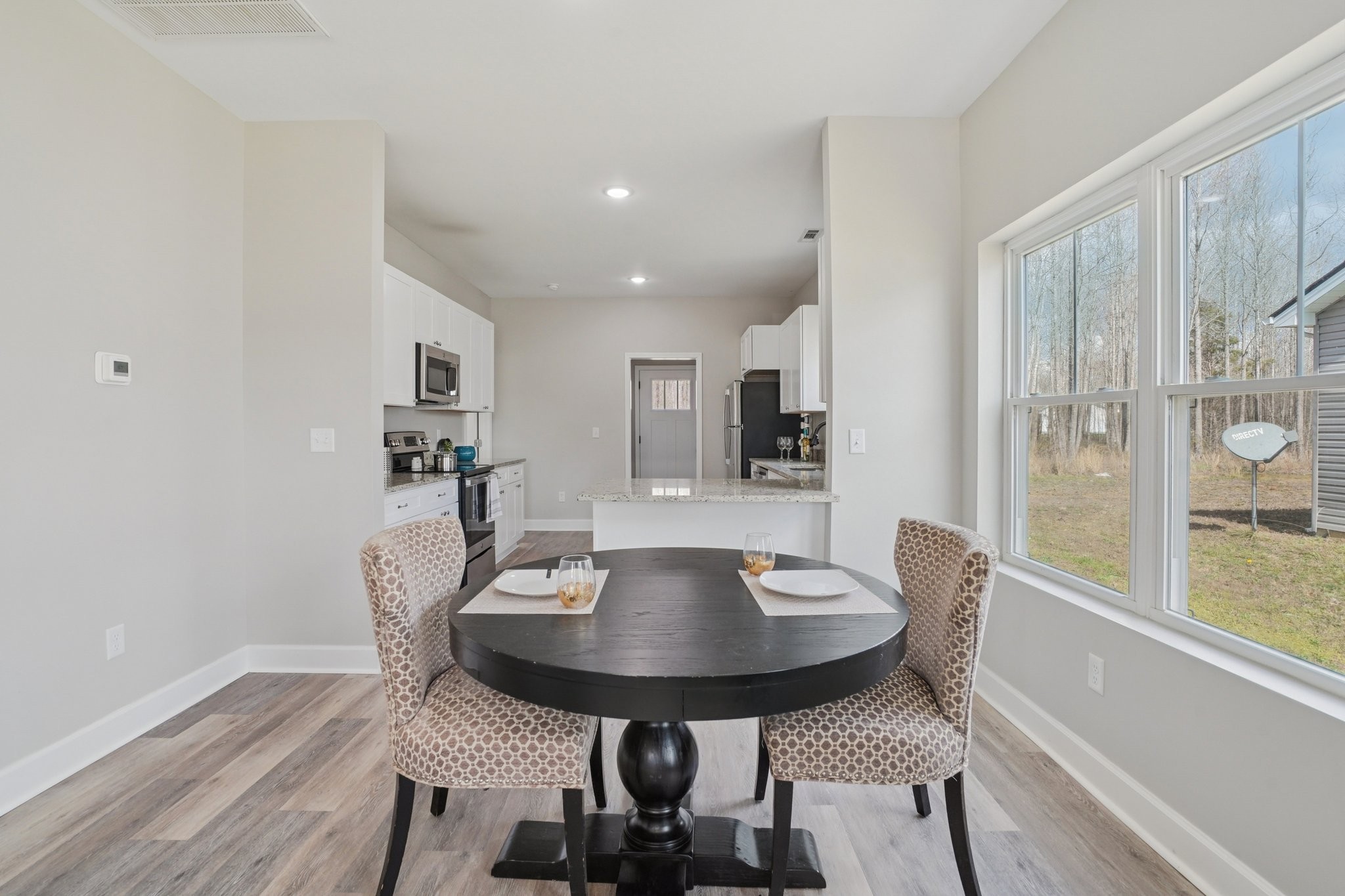 152 Eno Road Dickson, TN 37055 - Photo 11 of 35 a view of a dining room with furniture and wooden floor