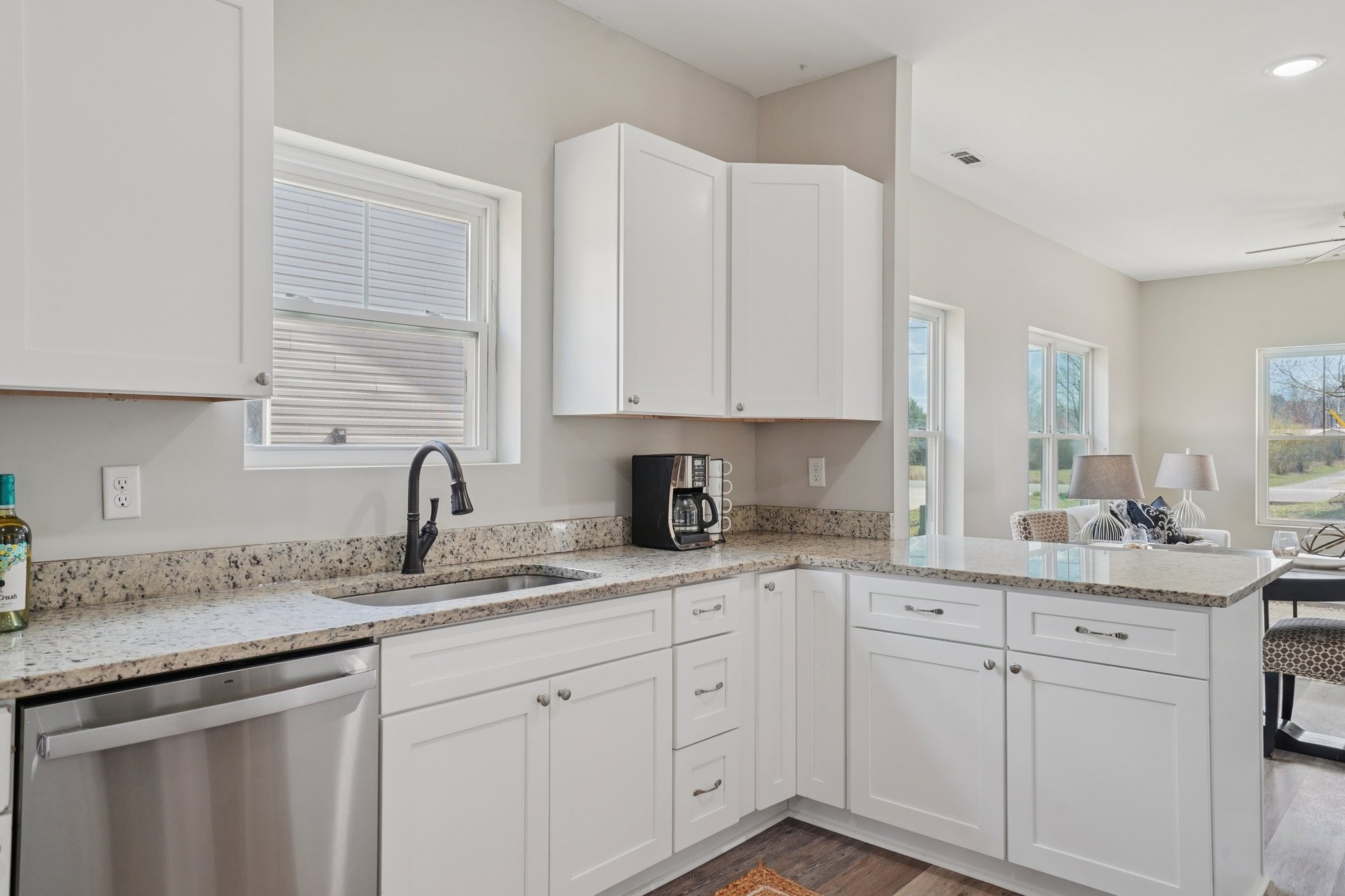 152 Eno Road Dickson, TN 37055 - Photo 14 of 35 a kitchen with stainless steel appliances granite countertop white cabinets sink and dishwasher