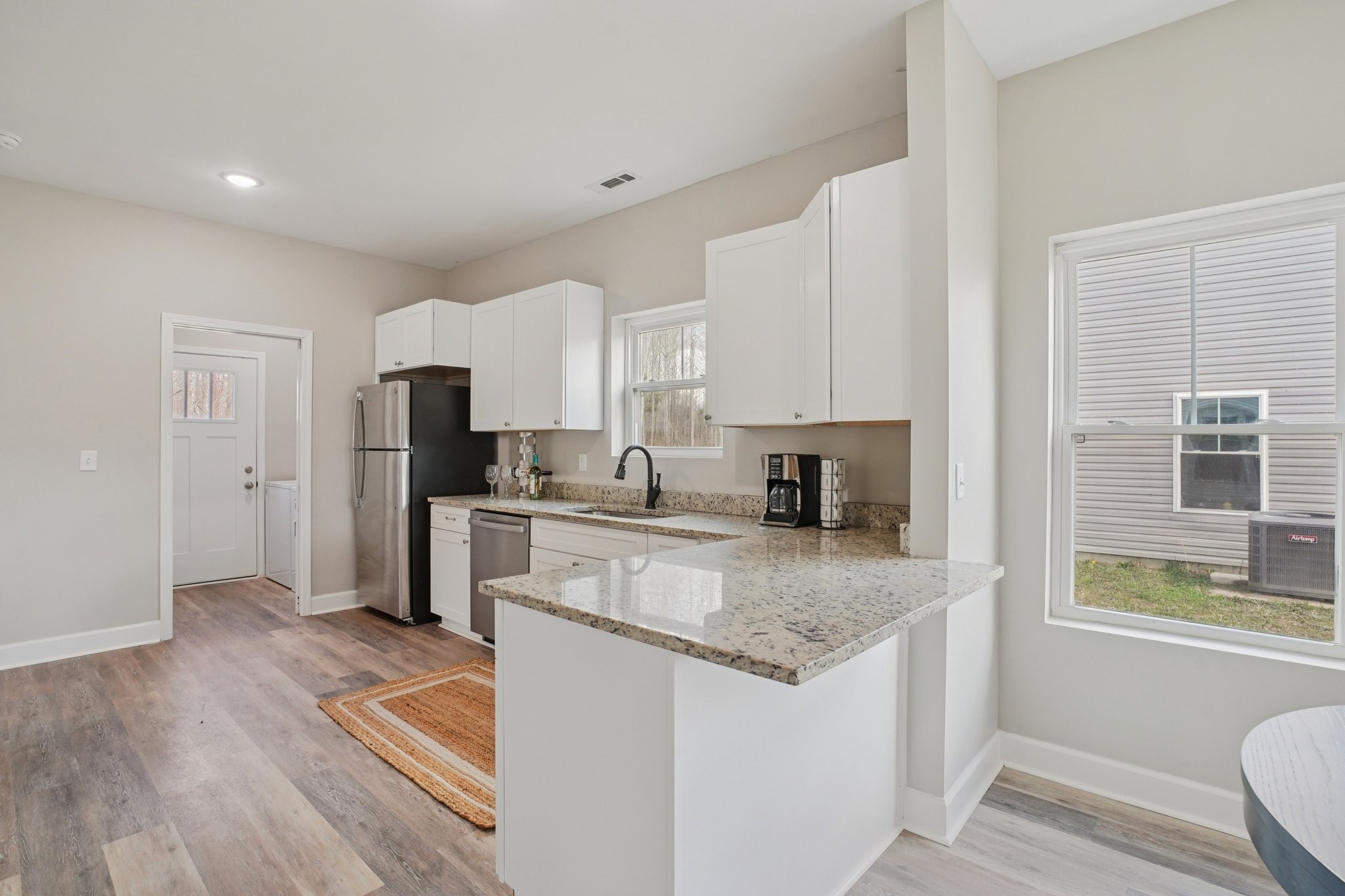 152 Eno Road Dickson, TN 37055 - Photo 17 of 35 a kitchen with stainless steel appliances granite countertop a refrigerator sink and stove
