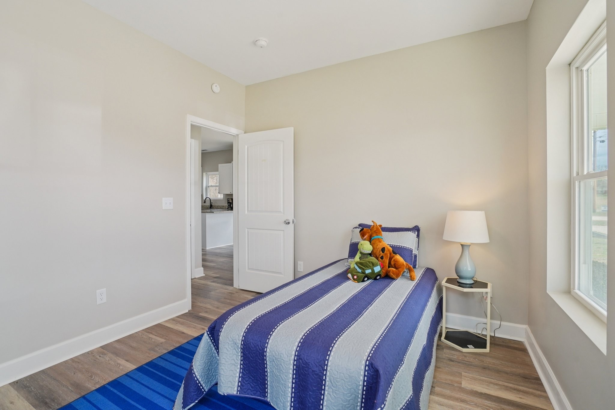 152 Eno Road Dickson, TN 37055 - Photo 22 of 35 a bed room with a bed and a lamp