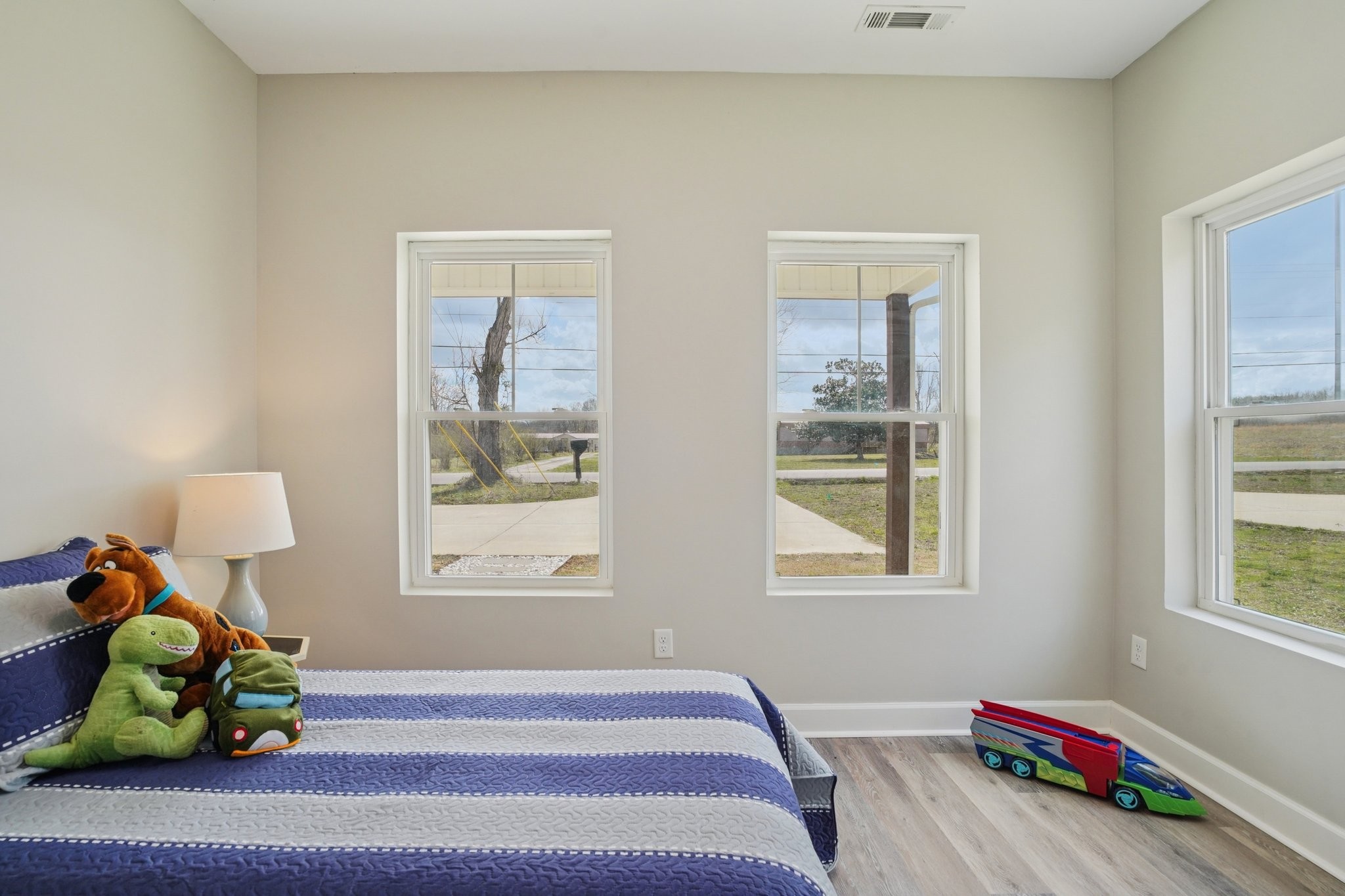 152 Eno Road Dickson, TN 37055 - Photo 23 of 35 a bedroom with a bed and wooden floor