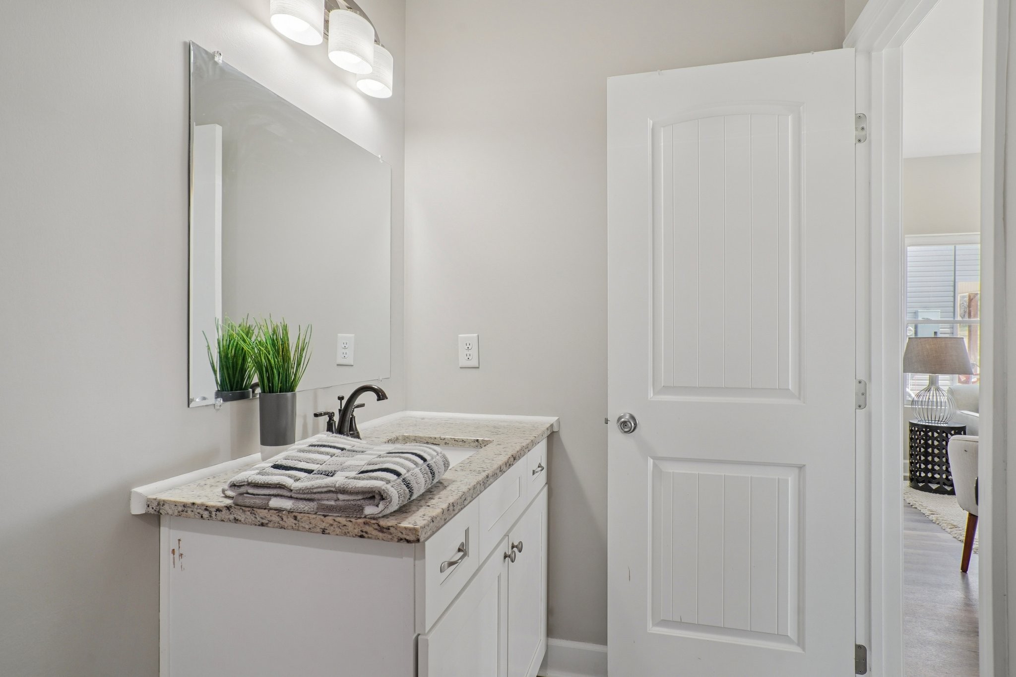 152 Eno Road Dickson, TN 37055 - Photo 24 of 35 a bathroom with a granite countertop sink and a mirror