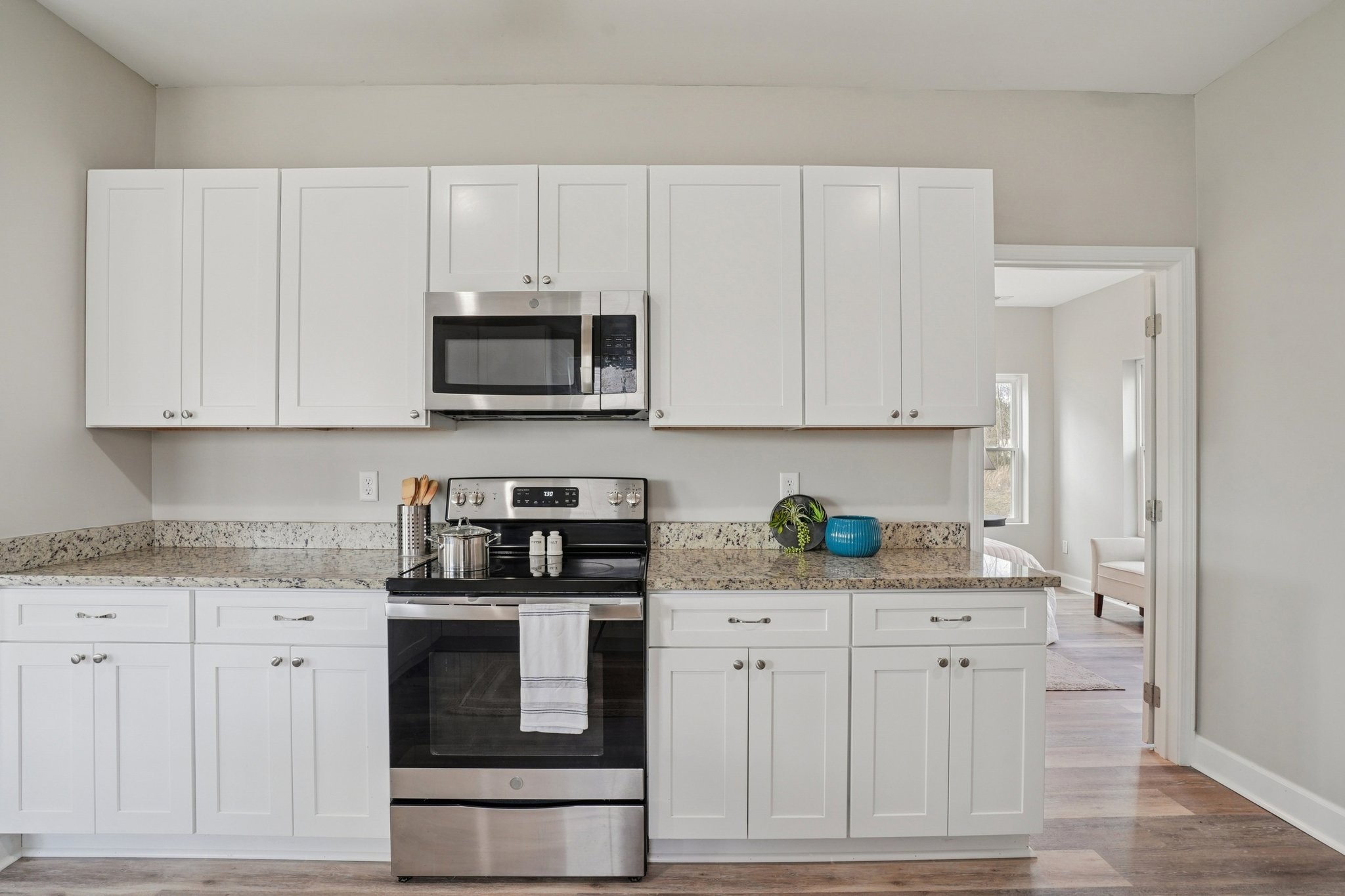 152 Eno Road Dickson, TN 37055 - Photo 4 of 35 a kitchen with stainless steel appliances granite countertop a stove a microwave and cabinets