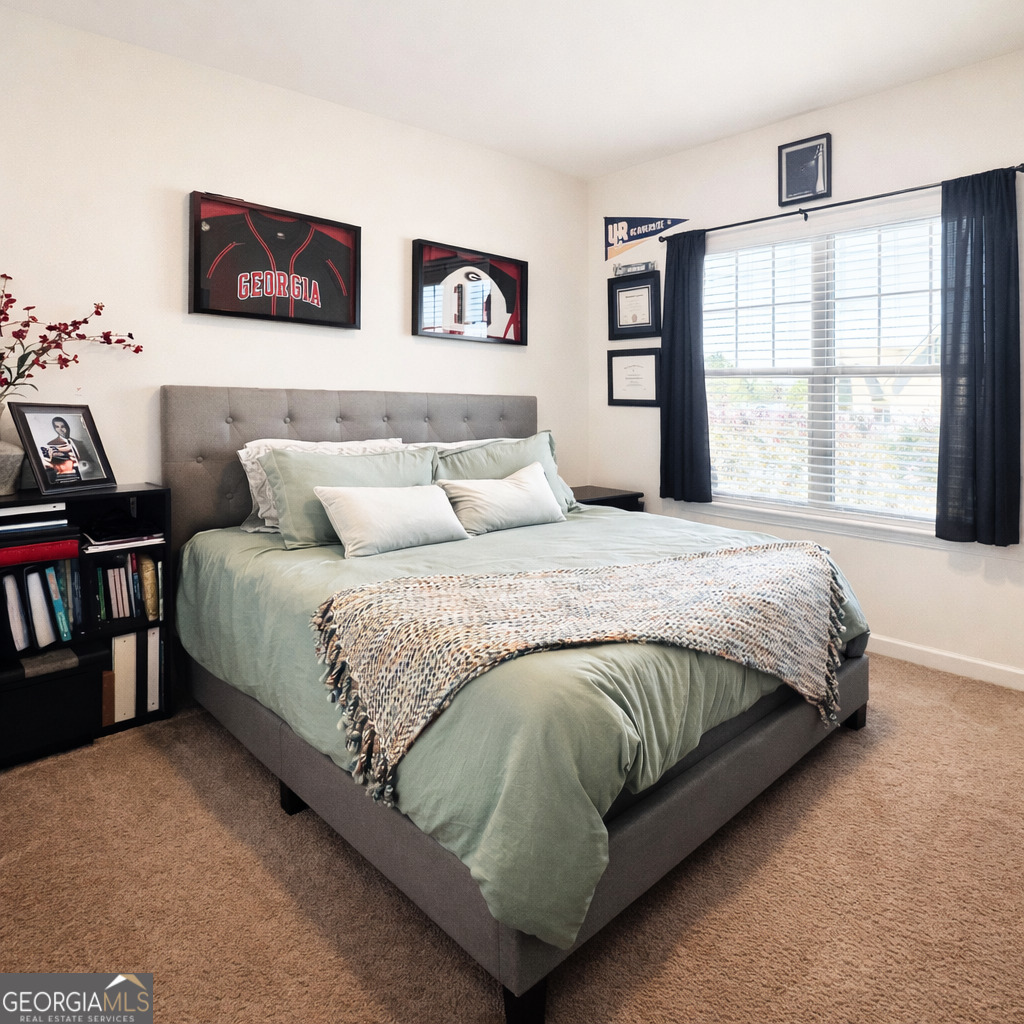 78 Willowrun Drive Rome, GA 30165 - Photo 26 of 35 a large bed sitting in a bedroom next to a window with a picture of a bedroom
