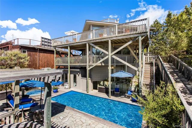 a view of a chairs and table in the patio