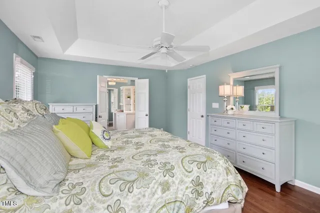 a view of a bathroom with a sink and mirror with bathtub