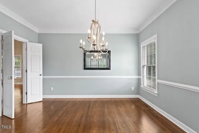 a view of a livingroom with wooden floor and fireplace