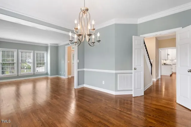 a living room with furniture a fireplace and a large window