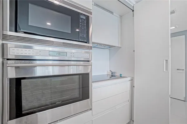 a bathroom with a stove and a microwave