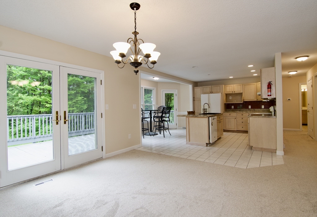 97 Monson Road Brimfield, MA 01010 - Photo 15 of 42 a view of a livingroom with a furniture wooden floor and a chandelier