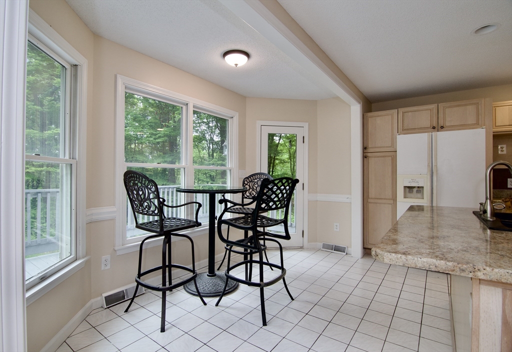 97 Monson Road Brimfield, MA 01010 - Photo 20 of 42 a view of a dining room with furniture window and outside view